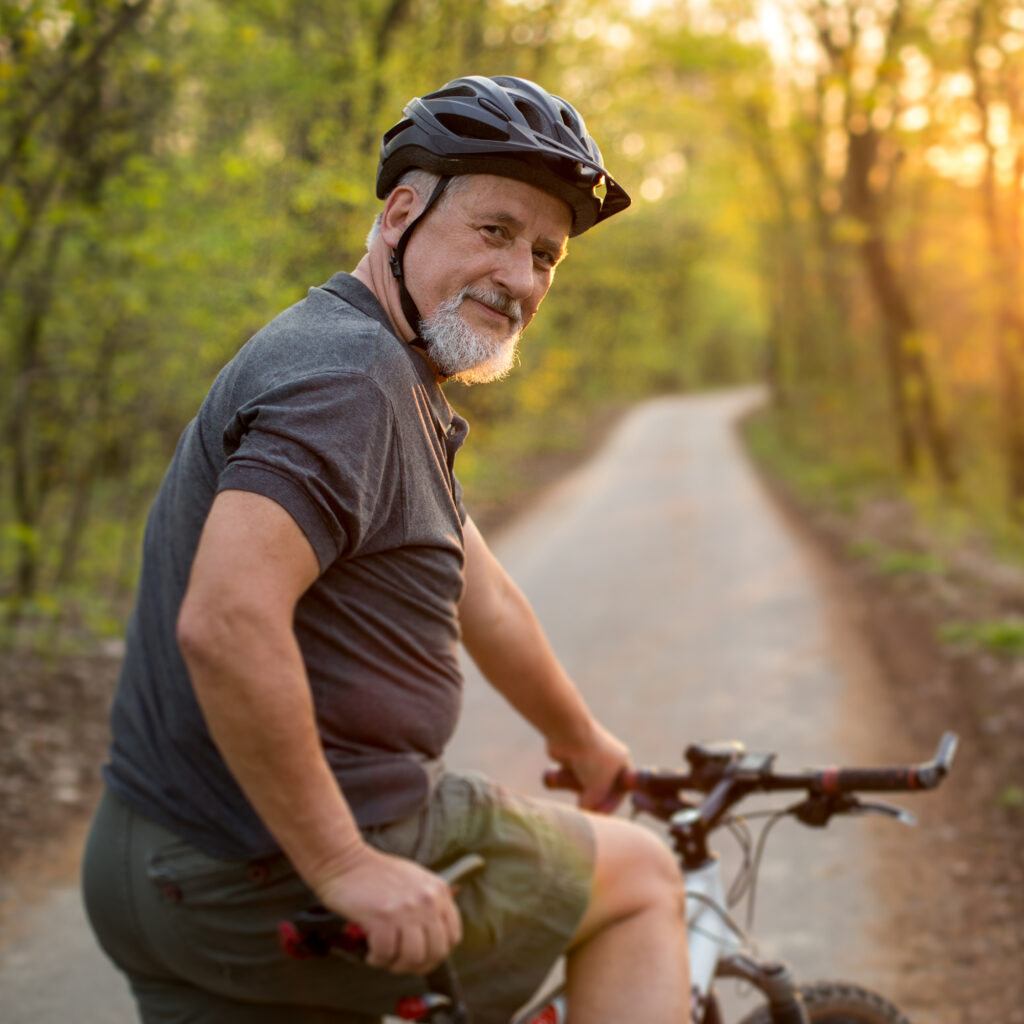 Senior man on his mountain bike outdoors