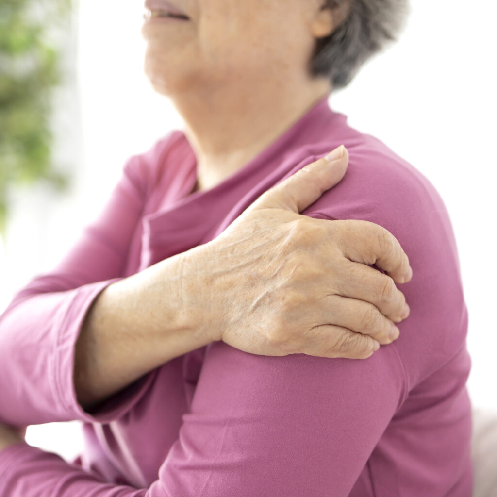 Senior woman shoulder pain osteochondrosis