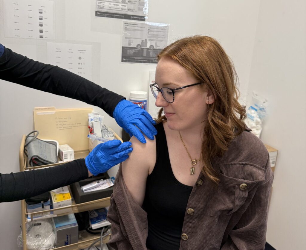 customer receiving vaccine at curtis pharmacy
